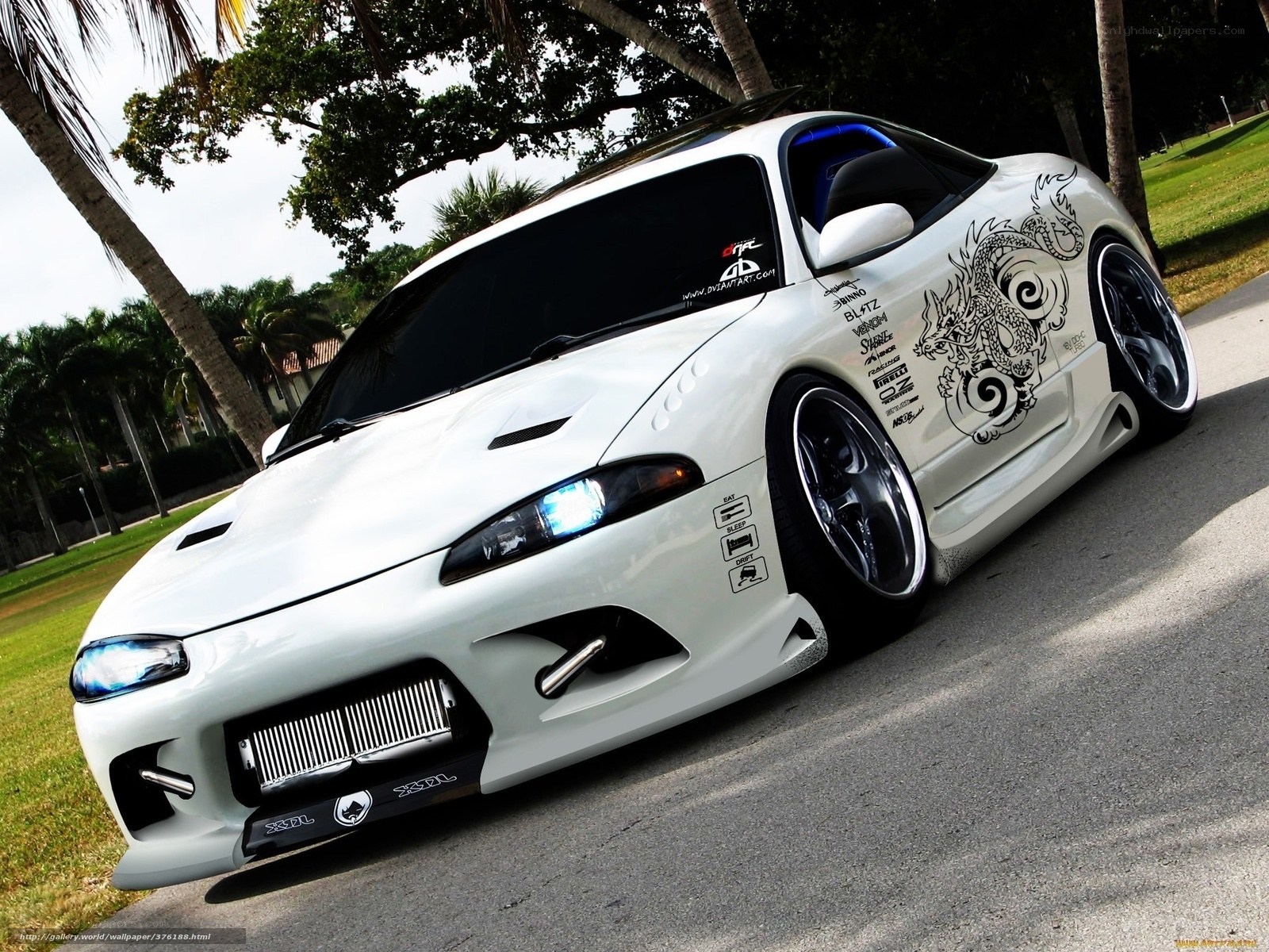 white sports car with dragon design