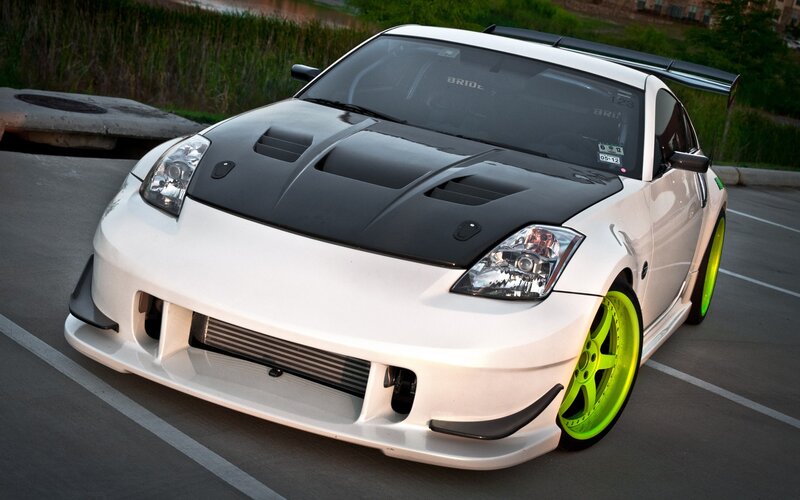 white sports car with green wheels