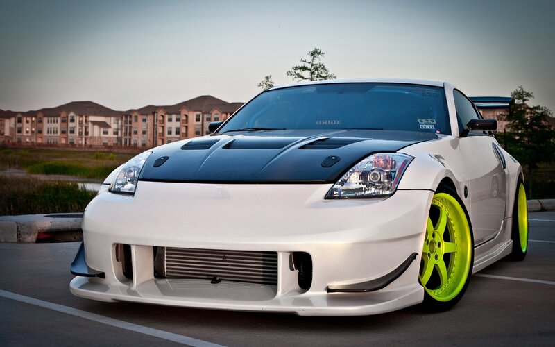 white sports car with neon wheels