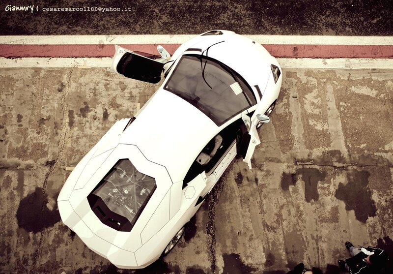 White sports car with open doors