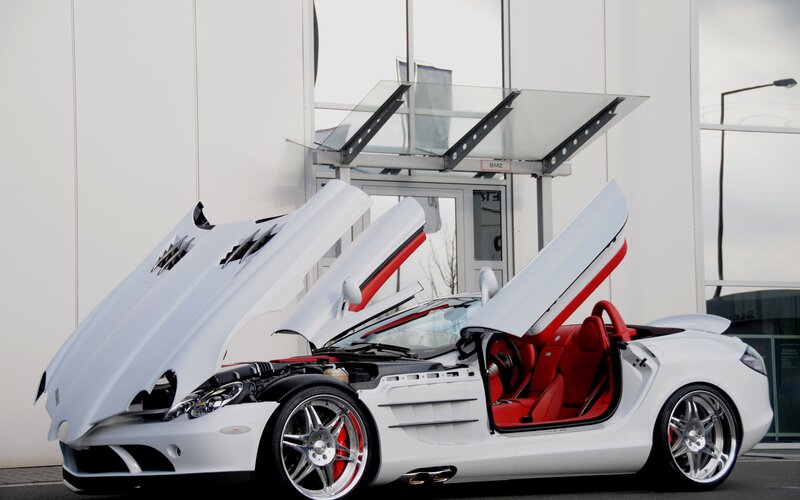 White sports car with open doors