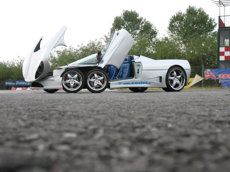 White sports car with open doors