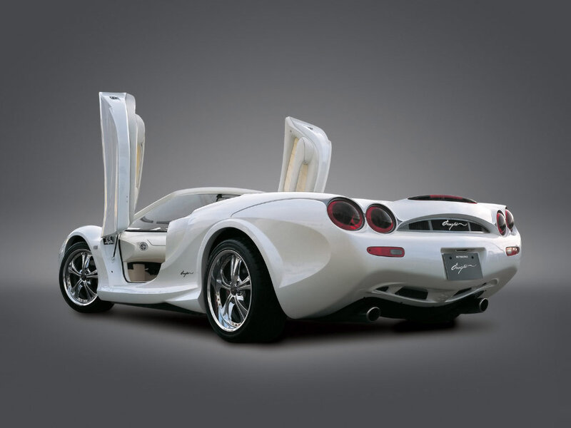 White sports car with open doors