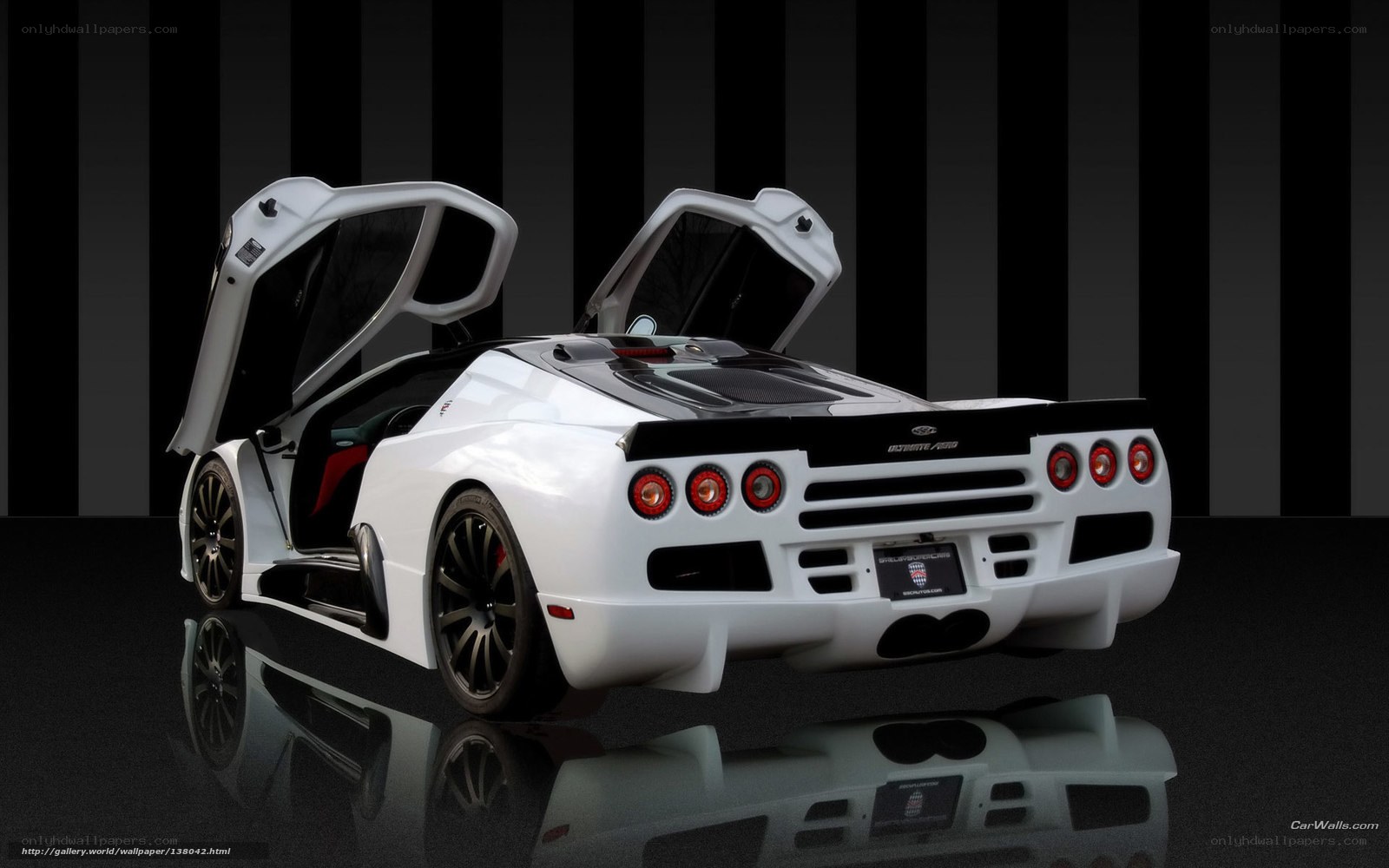 white sports car with open doors
