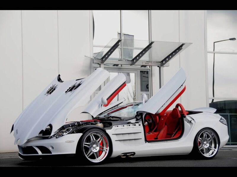 White sports car with open doors