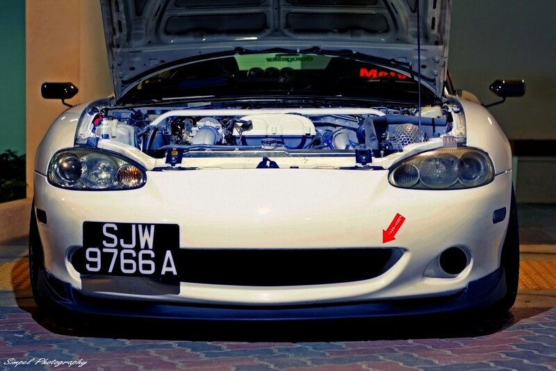 white sports car with open hood