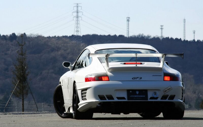 white sports car with rear wing