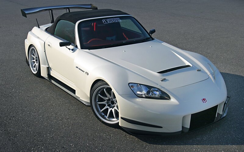 white sports car with rear wing
