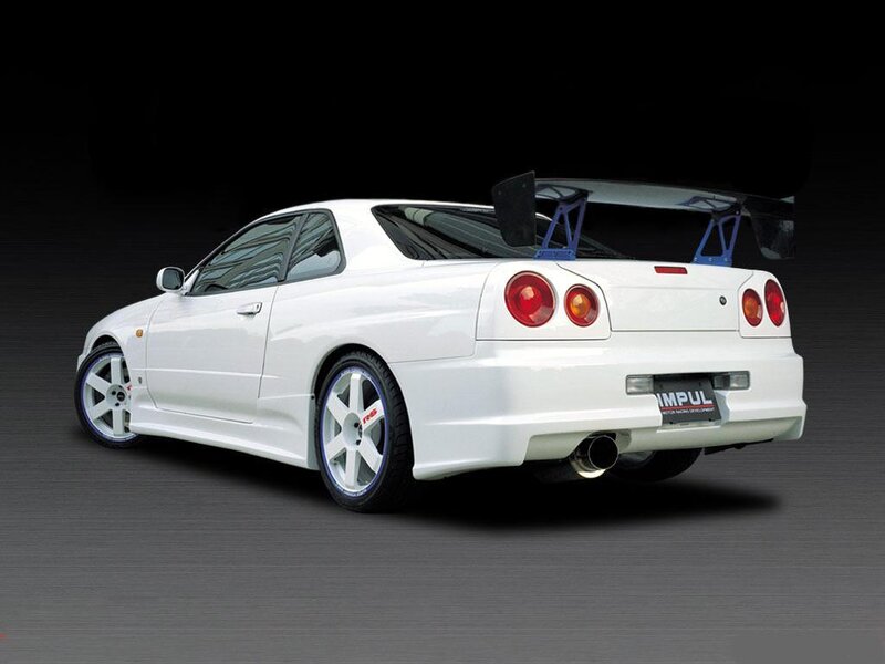 white sports car with rear wing