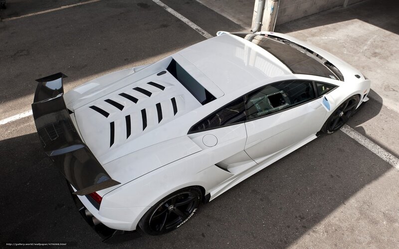 white sports car with rear wing