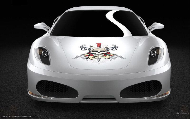 white sports car with skull decal