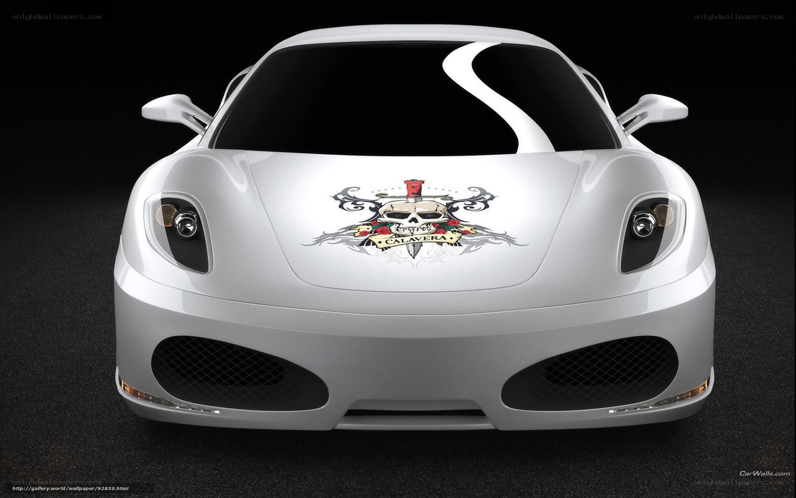 white sports car with skull decal