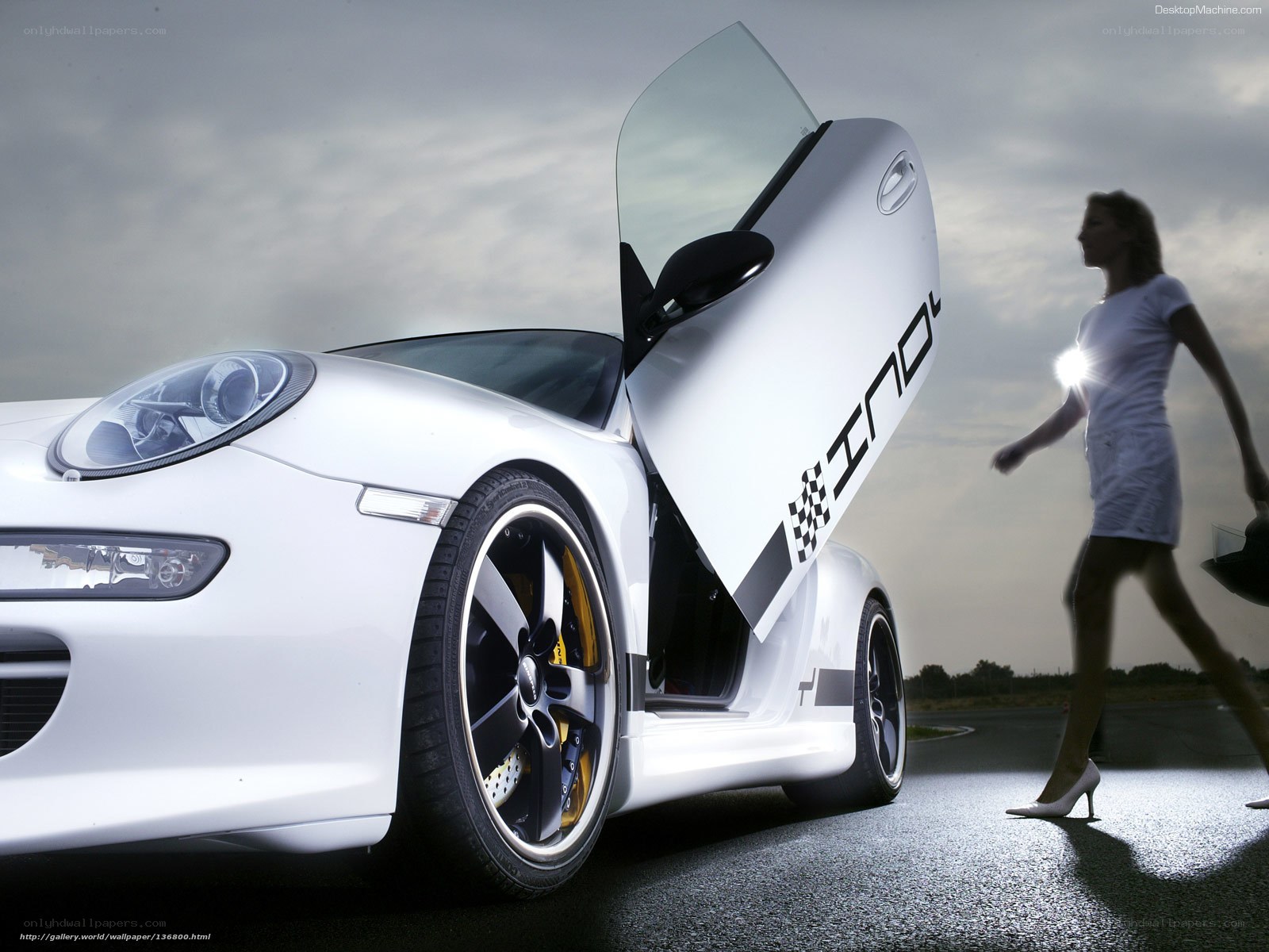 White sports car with woman