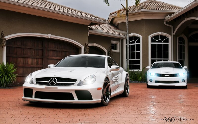 White sports cars in driveway