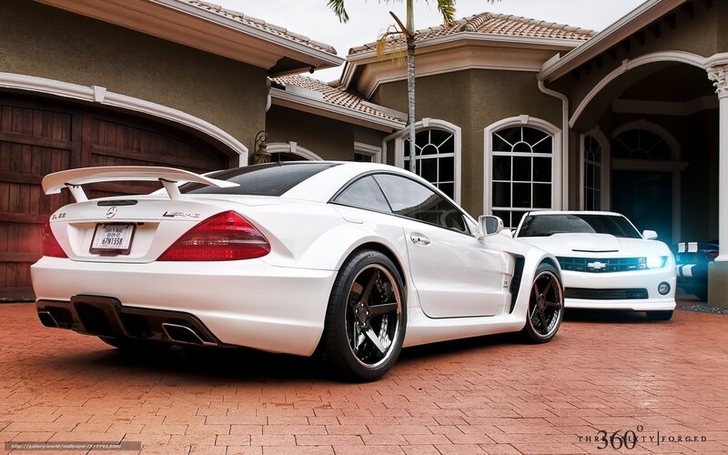 White sports cars in driveway