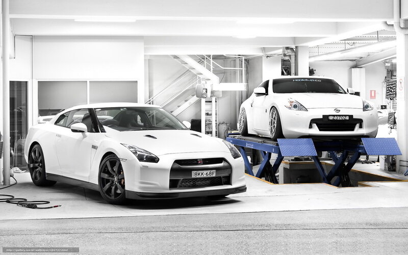 White Sports Cars in Garage — Clean