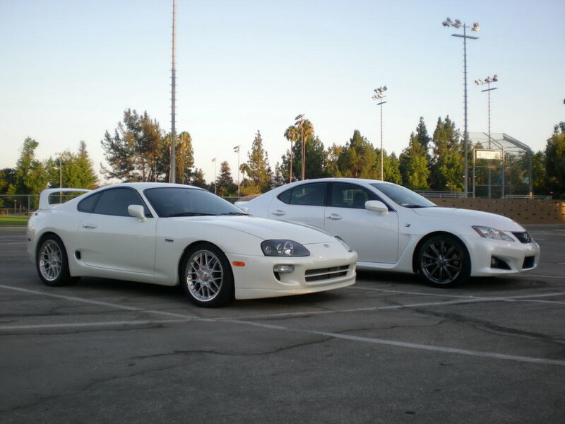 White sports cars in parking lot