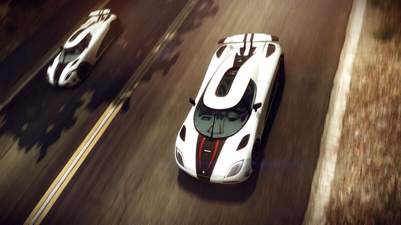 White sports cars racing on road