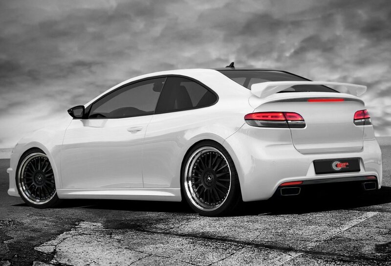 white sports coupe with custom wheels