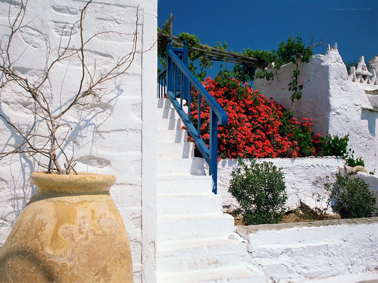 White stairs with blue railing