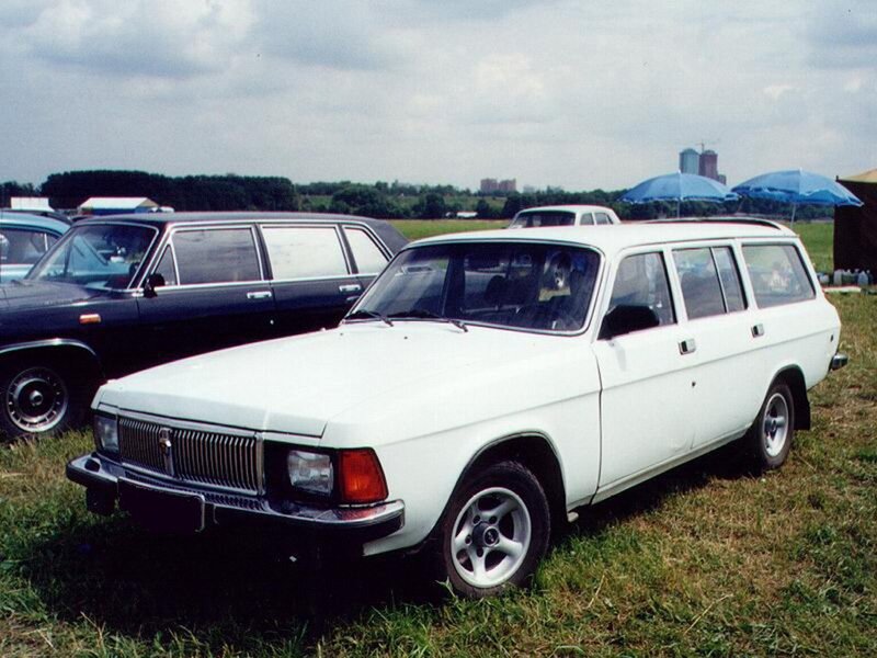 White station wagon at outdoor event