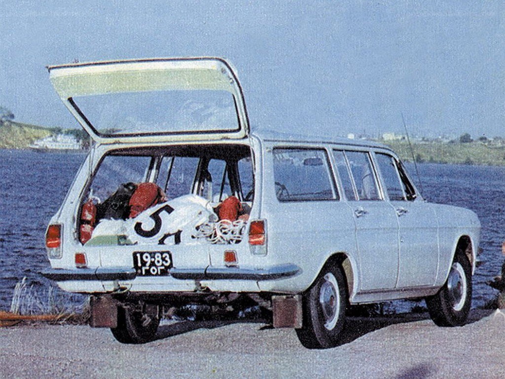 White station wagon by the water