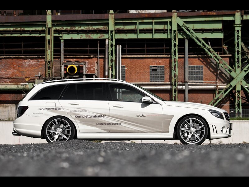 white station wagon in industrial setting