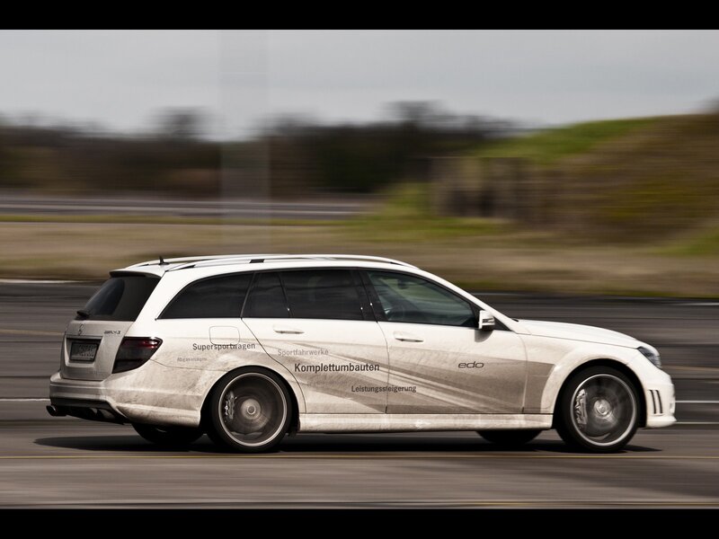 white station wagon in motion