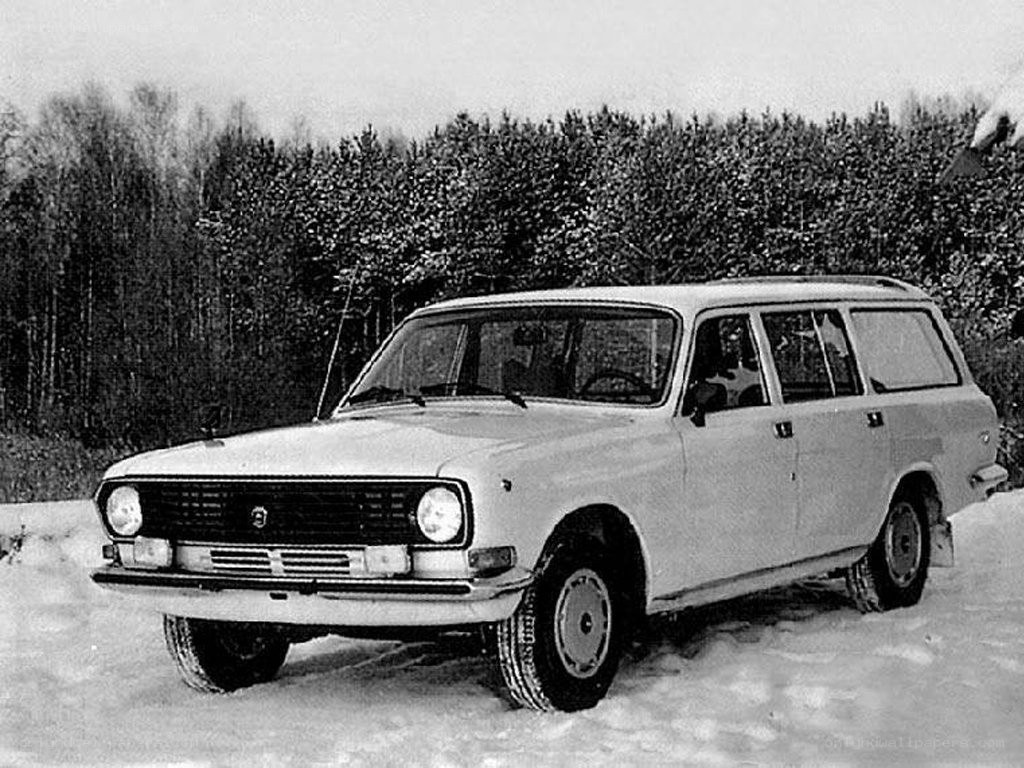 White station wagon in snow