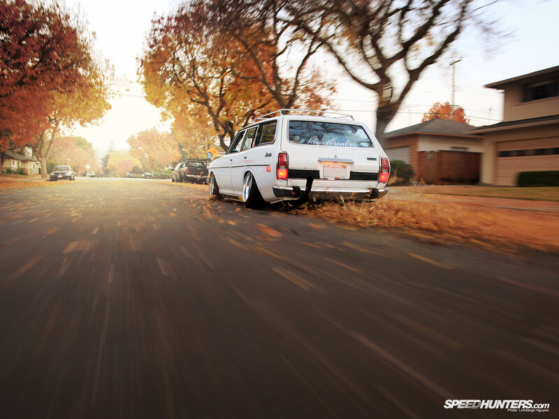 White station wagon on autumn street