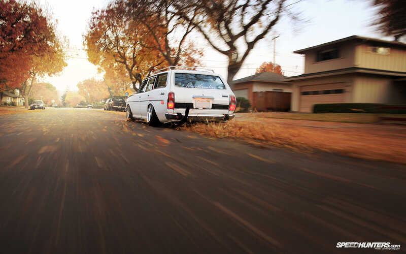 White station wagon on autumn street