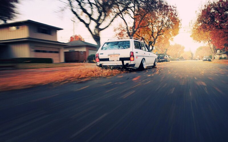 white station wagon on autumn street