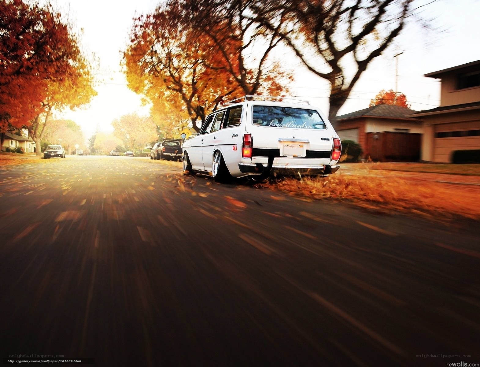 White station wagon on autumn street