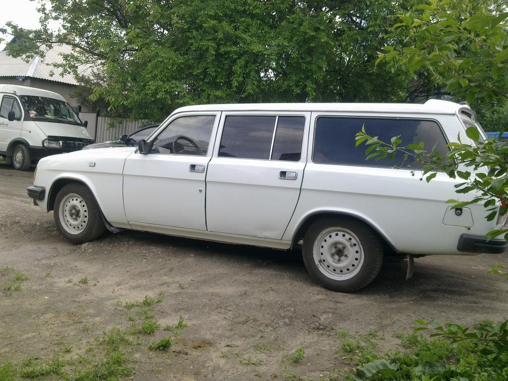 white station wagon parked outside