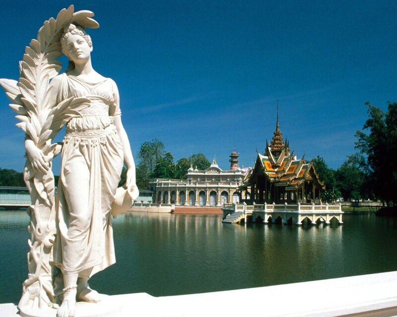 White Statue Near Lake — Blue