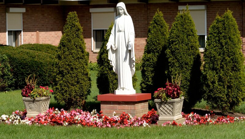 White Statue of Virgin Mary — Green
