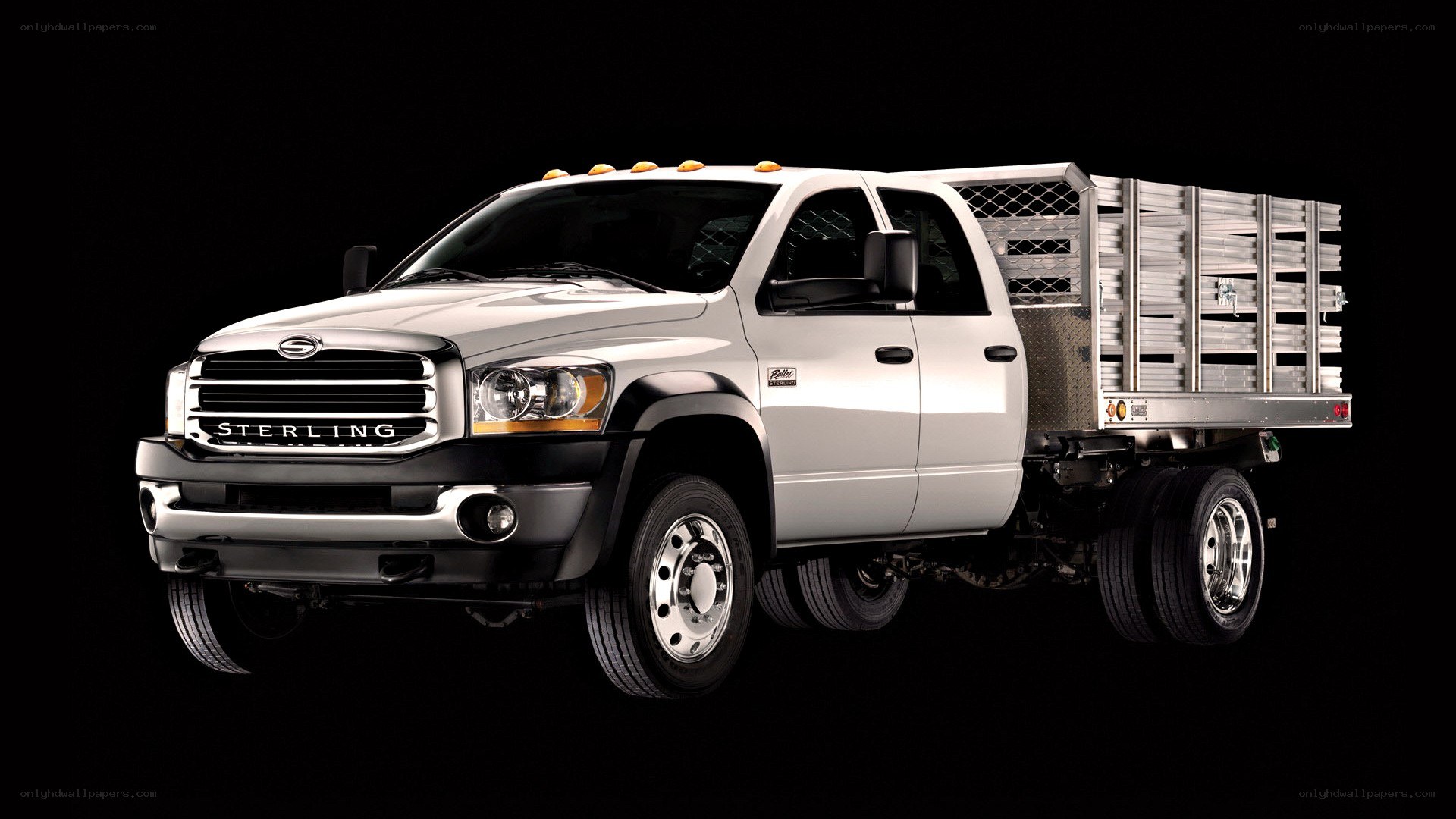 white Sterling truck with flatbed