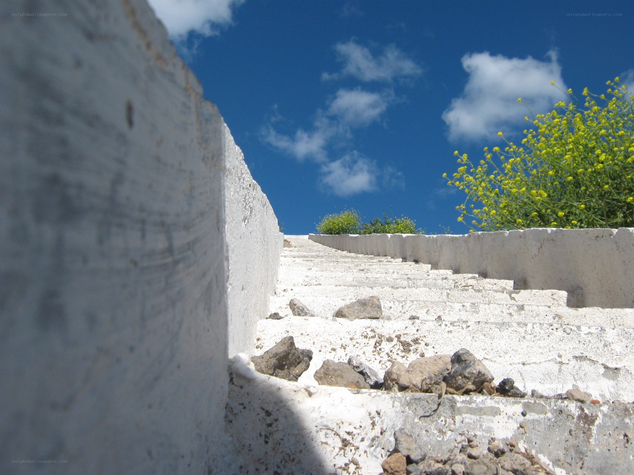 White stone stairs under blue sky