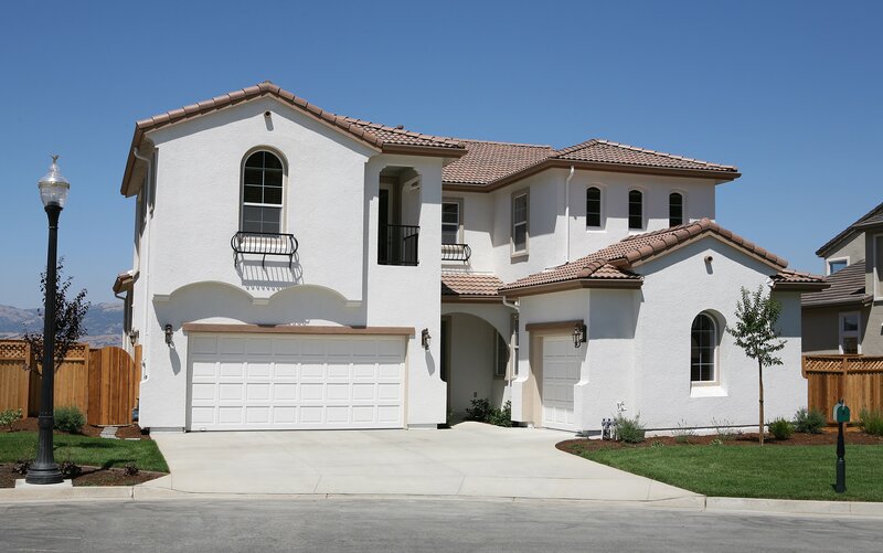 white stucco house with tiled roof