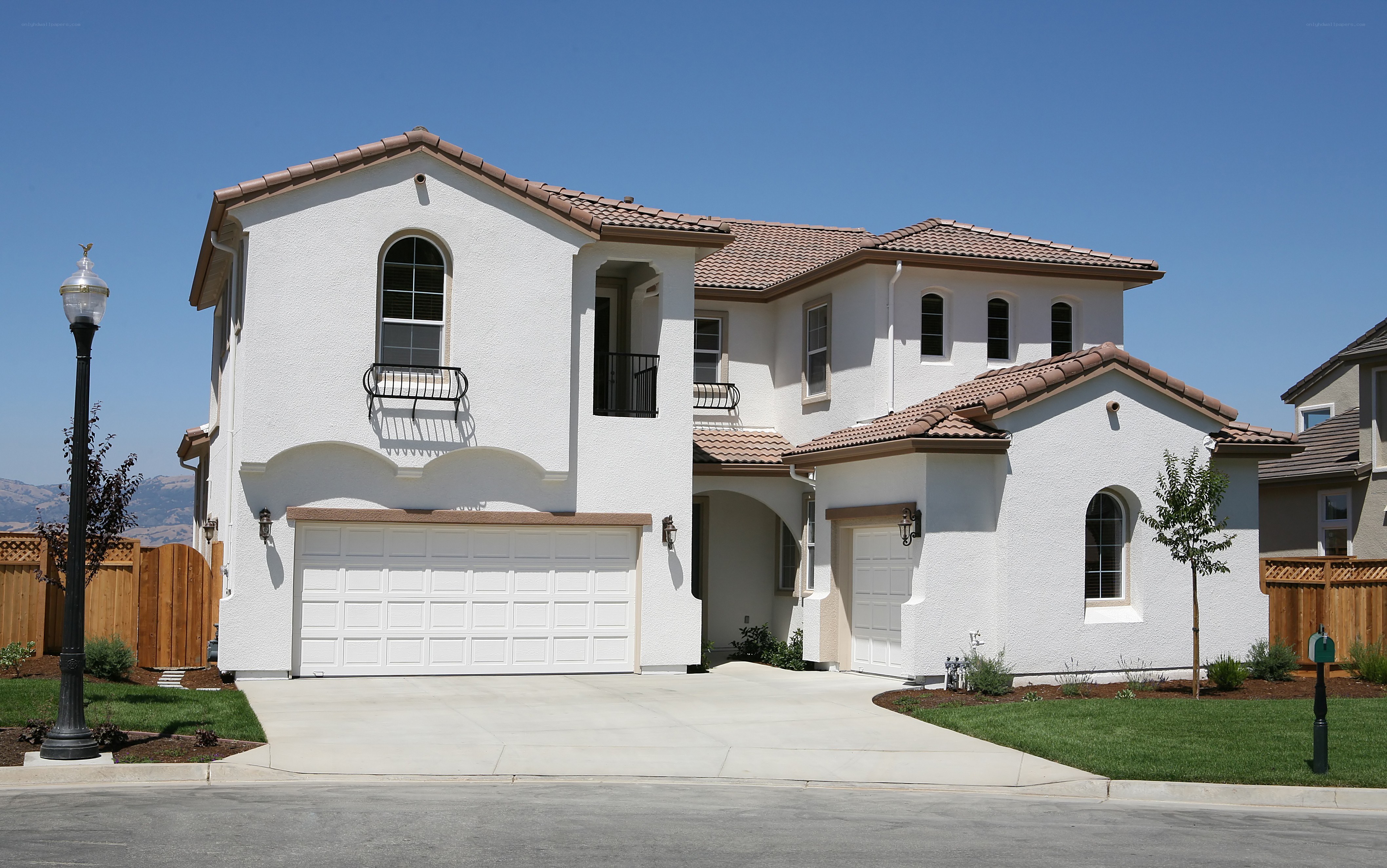 white stucco house with tiled roof
