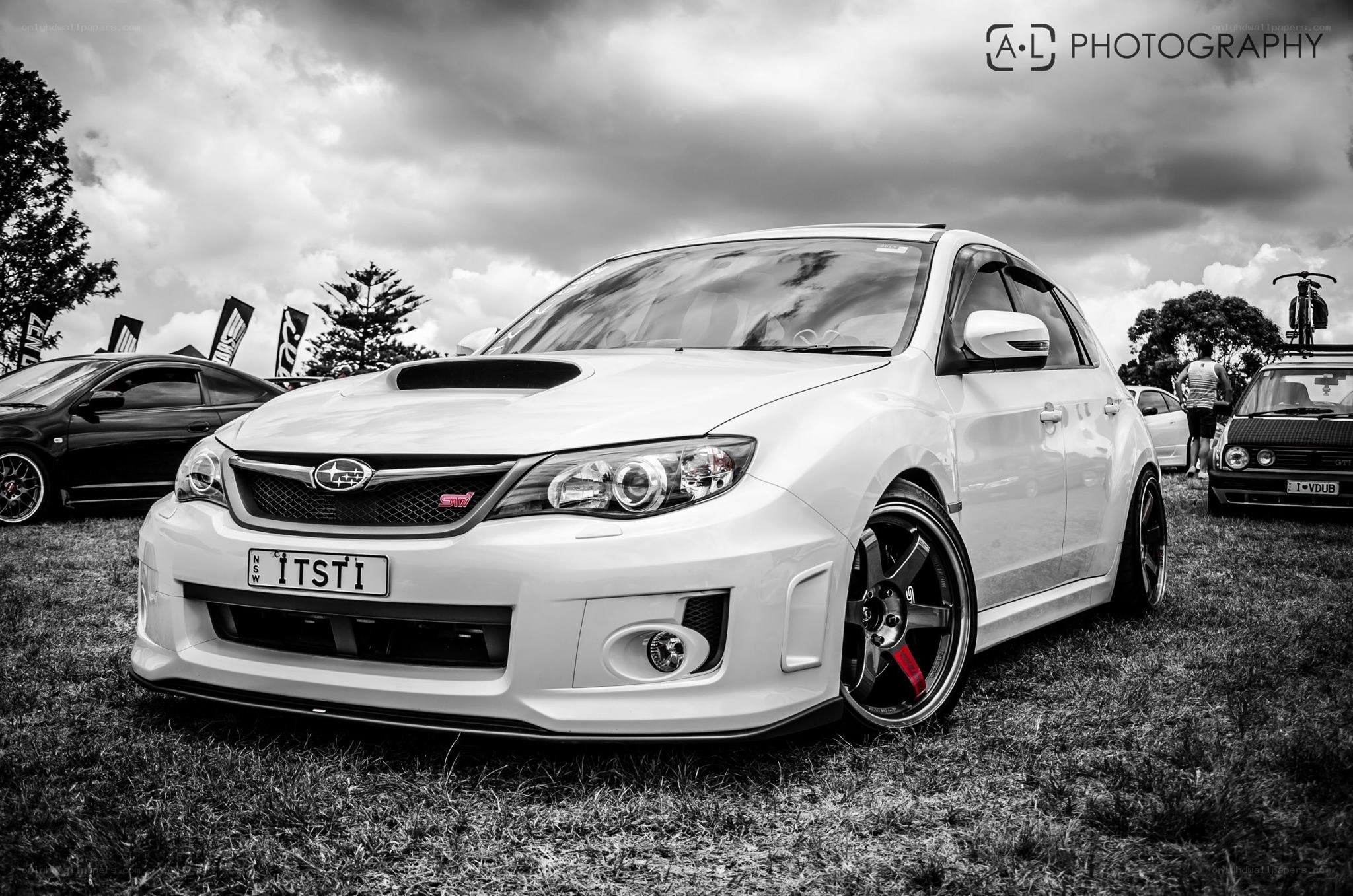 White Subaru at car show