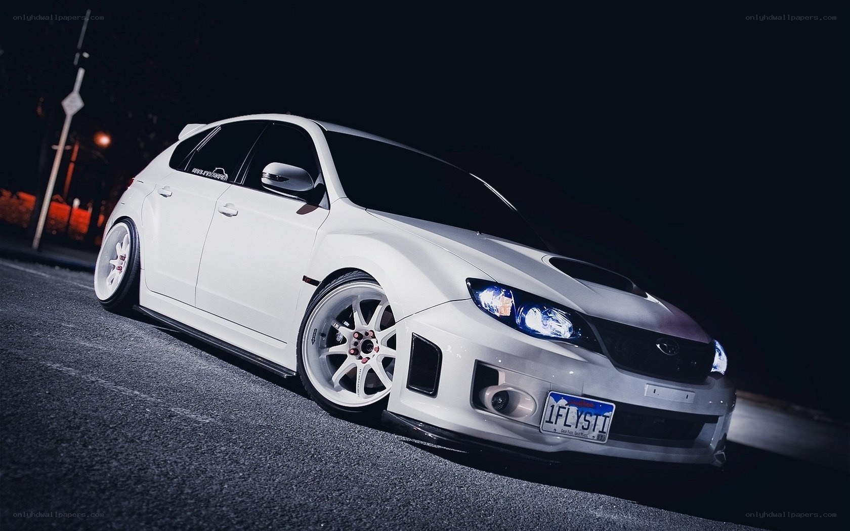 white subaru at night