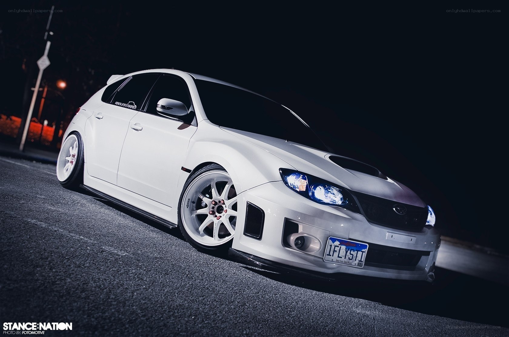 white subaru at night