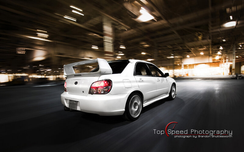white subaru in motion