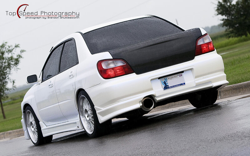 white subaru in rain
