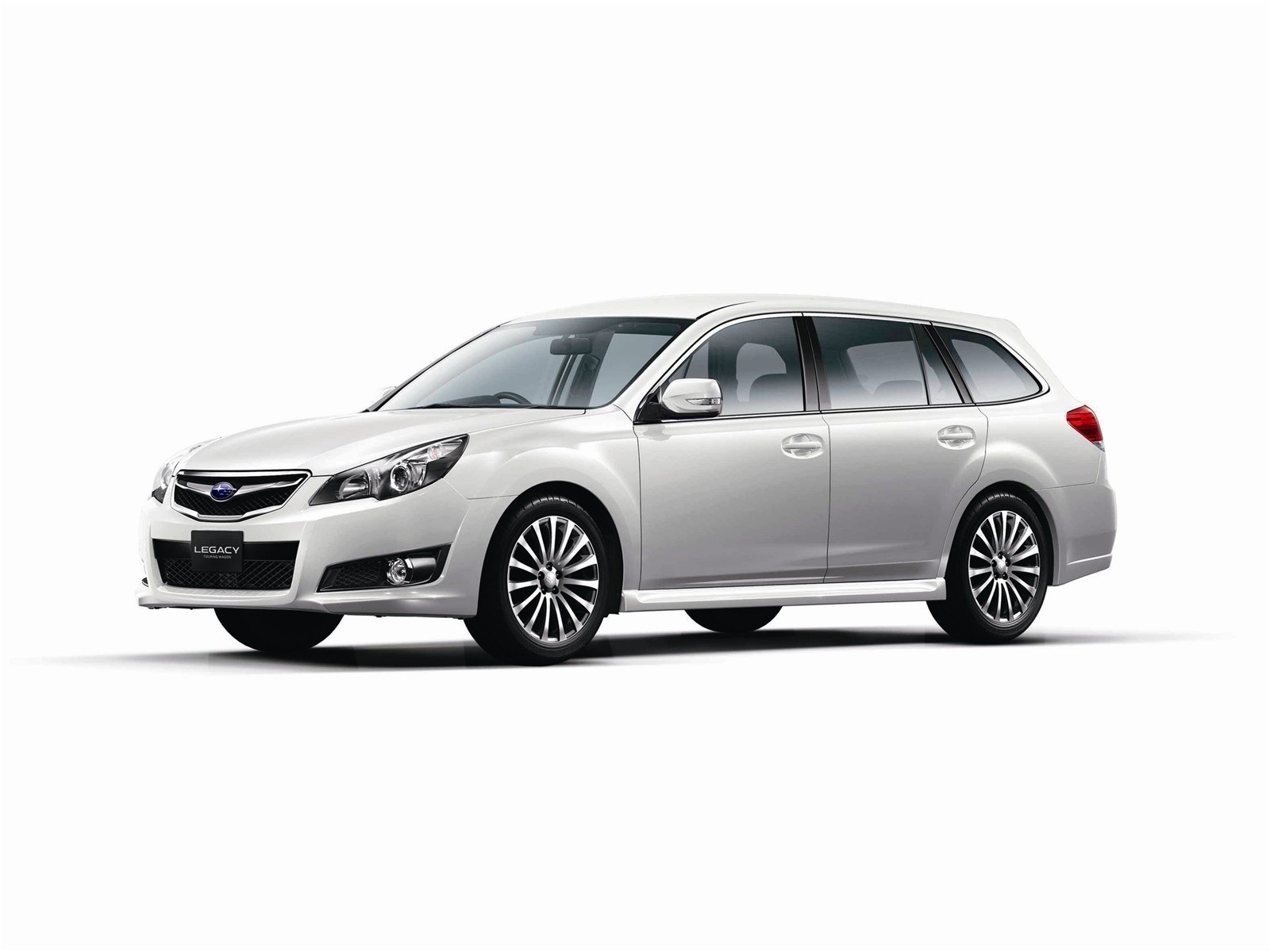 white subaru legacy station wagon