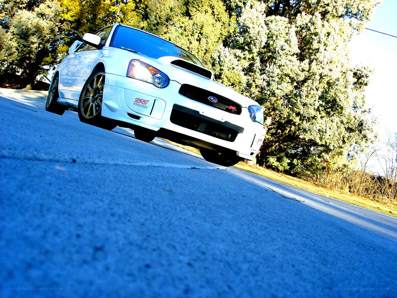white subaru on a road