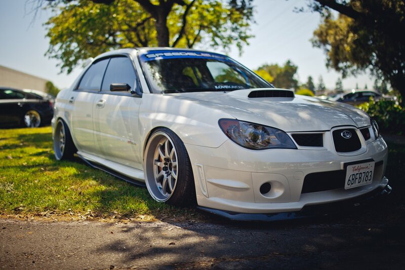 white subaru on grass