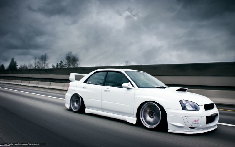 white subaru on highway