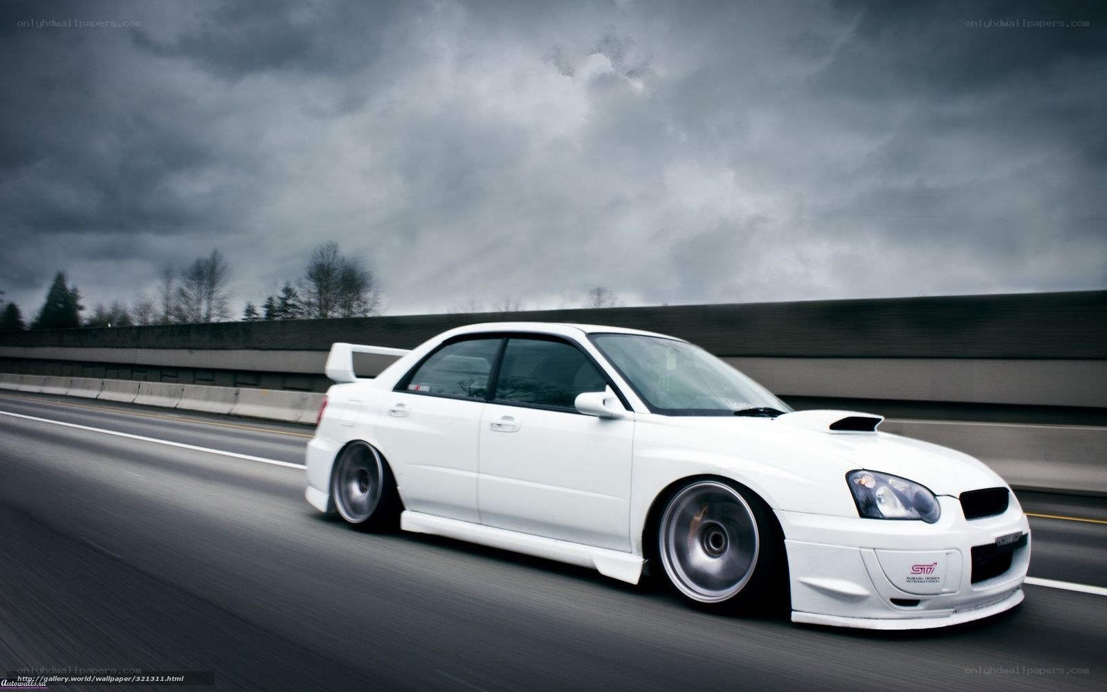 white subaru on highway